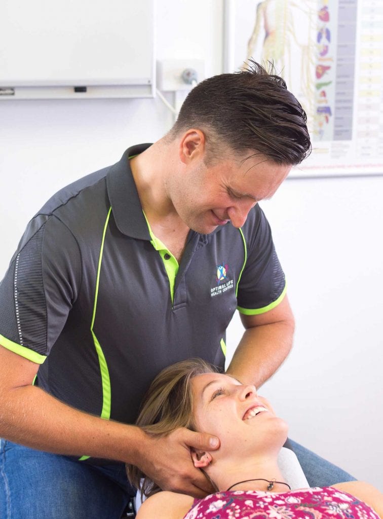 Dr Ben performing cervical adjustment